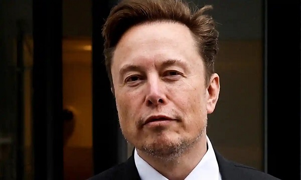 Pic of Elon Musk in suit. Credit:Jonathan Ernst/Reuters